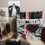 Nevernight inspired fabric book organiser with artistic designs filled with books, on a shelf with decorative items. image