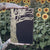 Lips Touch by Laini Taylor Illumicrate edition in a field of sunflowers image