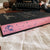 Mortal Follies by Alexis Hall digitally sprayed pink edges, with a purple bird at the bottom of the long edge. image